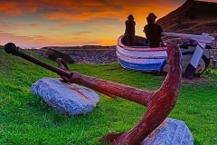 An old anchor and a Whitby Coble boat